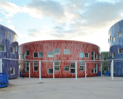 children's innovation centre in valencia clad in colorful tiles