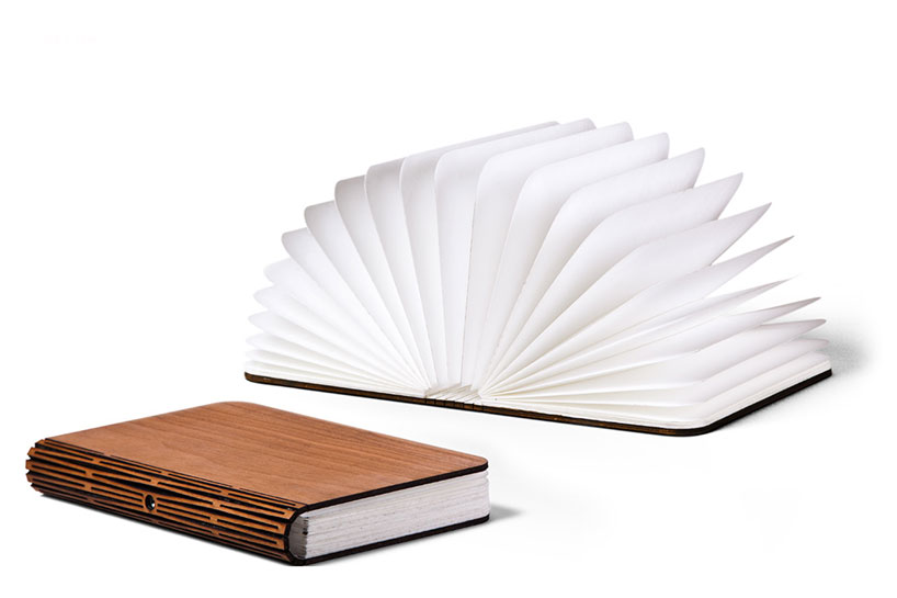lumio unfolds from a book into a lamp