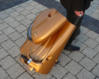 moveo lightweight electric scooter folds and rolls like a suitcase
