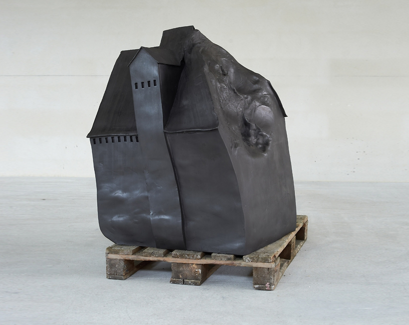 erwin wurm kicks, punches and steps on his architectural clay sculptures