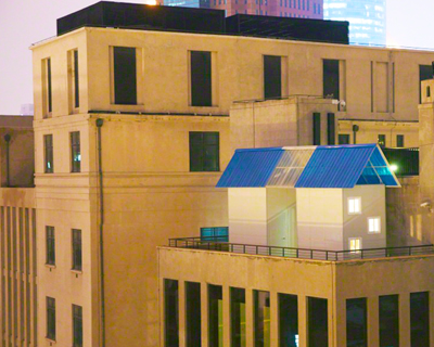 temporary structure setup on top of a museum model home by michael lin