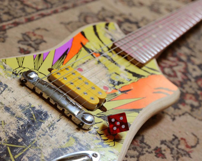reclaimed skateboard decks transformed into electric guitars