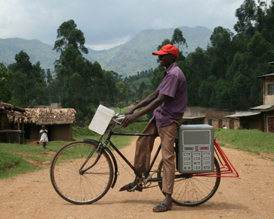 text message activated solar powered cellphone charging stations in uganda