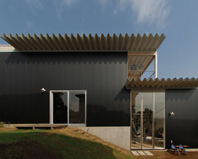 studio A transforms a retaining wall into G house