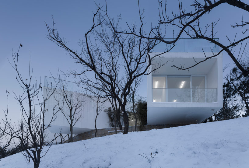 TAO: viewing pavilion on a hill in china rises from the woods