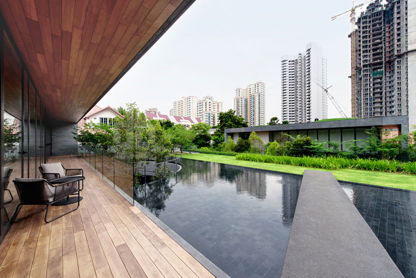 the wall house by FARM links two blocks with lush courtyard
