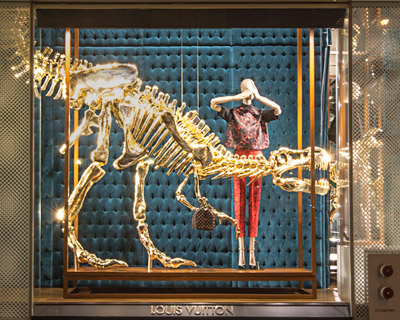louis vuitton's gilded dinosaur skeleton window installation
