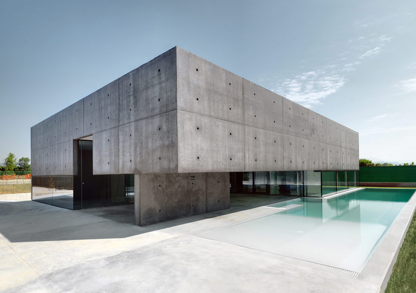 house in urgnano reframes the horizon with concrete  