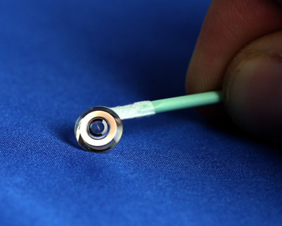 a telescope for your eye: optical zoom contact lenses