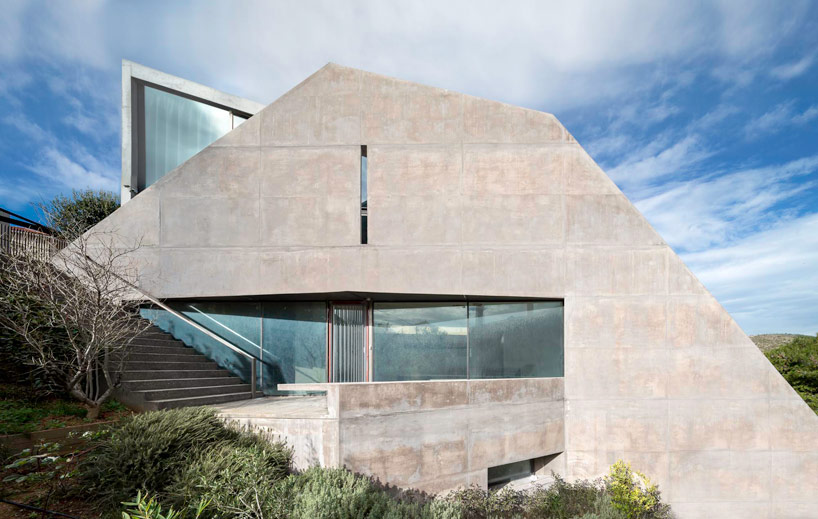 tense architecture network embeds home into a greek hill 