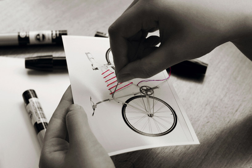 reel elastic bike frame storage system by areum jeong