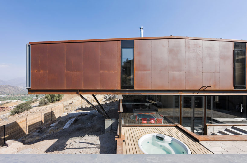 casa oruga: shipping container home snakes across the andes