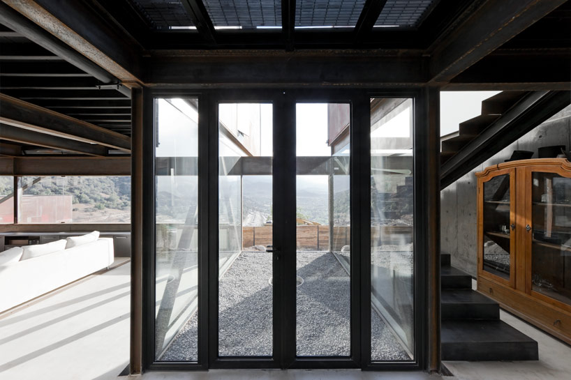 casa oruga: shipping container home snakes across the andes