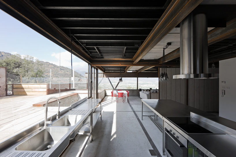 casa oruga: shipping container home snakes across the andes