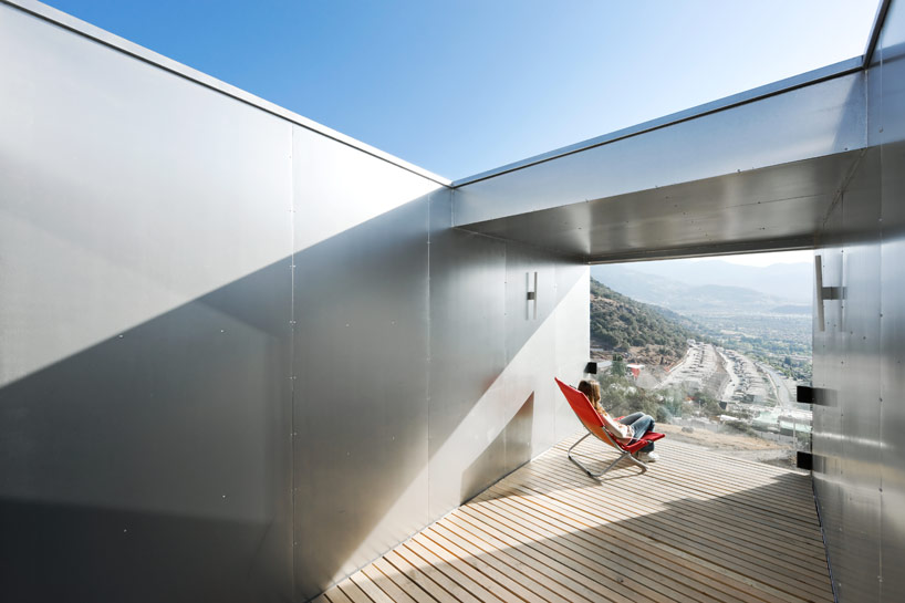 casa oruga: shipping container home snakes across the andes