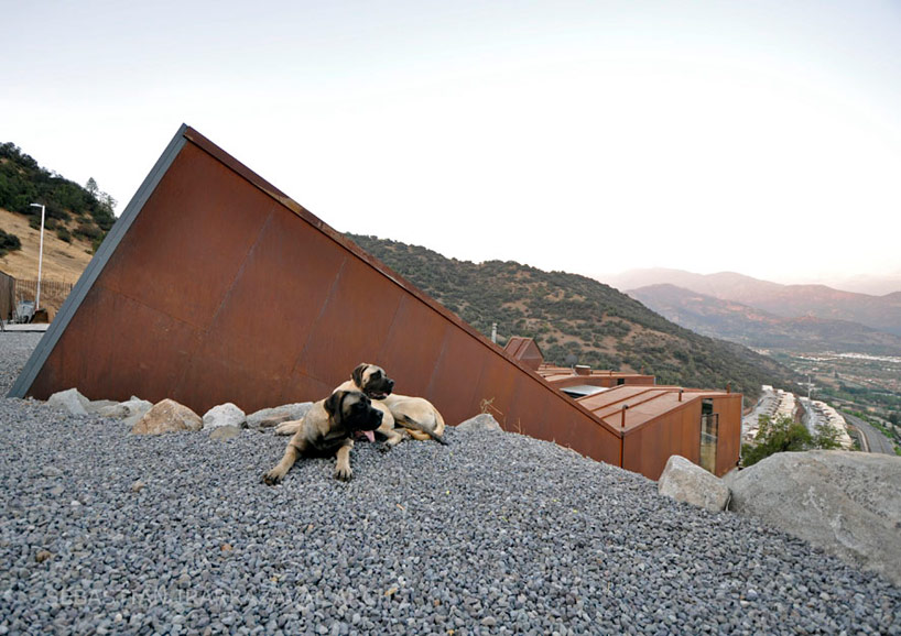 casa oruga: shipping container home snakes across the andes