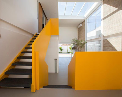 YTA architects: KR residence's geometric yellow ribbon