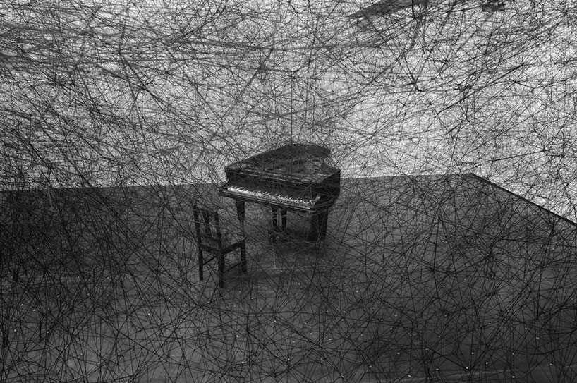chiharu shiota's thread wrapped charred piano for art basel