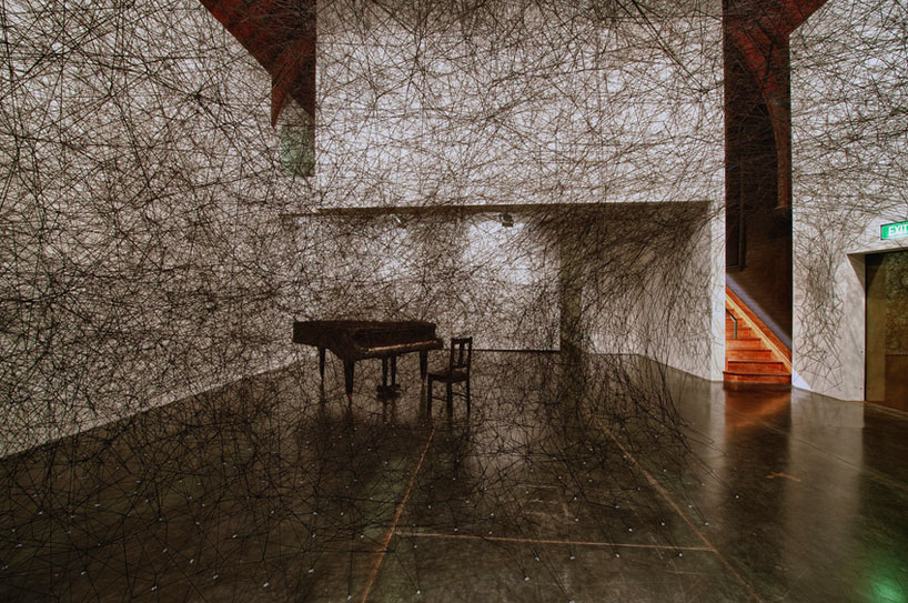 chiharu shiota's thread wrapped charred piano for art basel