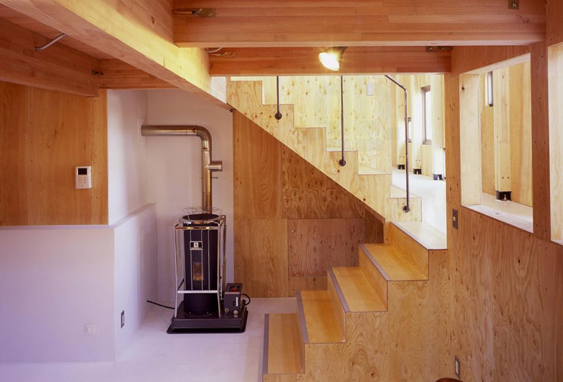milligram architectural studio designs house as nestled box