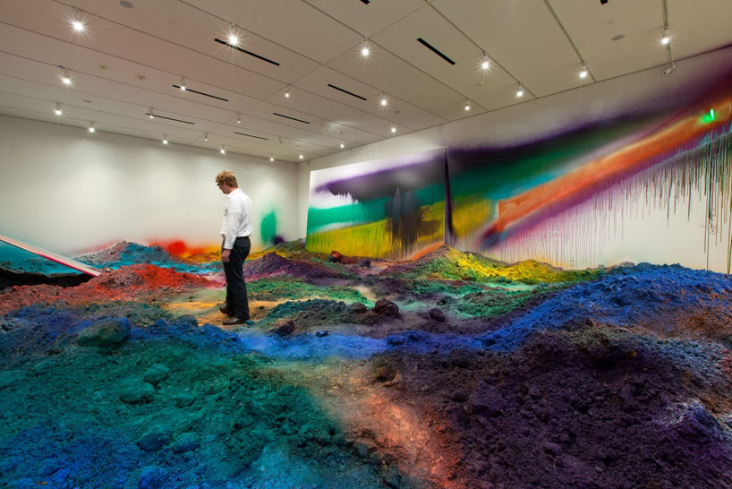 colorful mountains of spray-painted soil by katharina grosse
