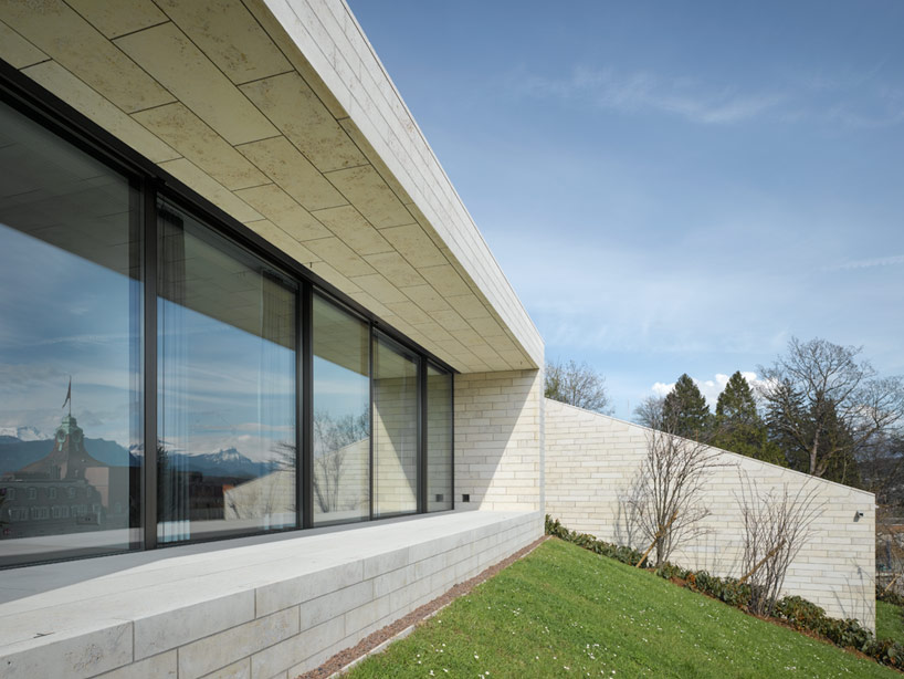 urban villas on lake lucerne create hillside periscopes