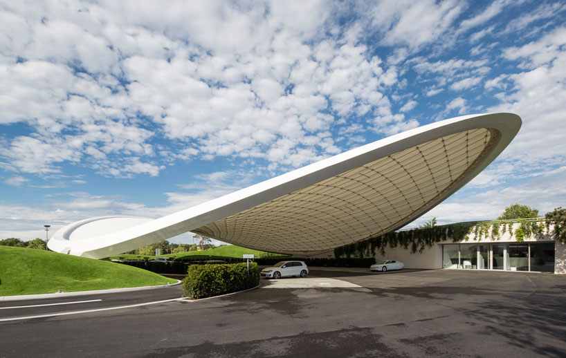 organically shaped autostadt roof and service pavilion by graft