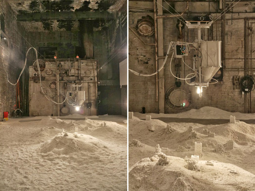 robot builds salt sculptures as visitors watch from a hot tub