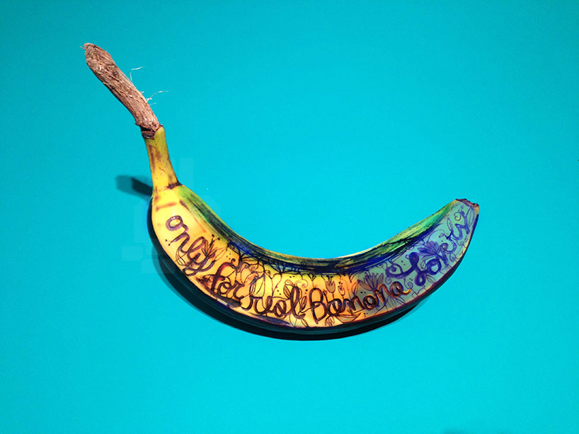 marta grossi inscribes onto temporary canvas for banana graffiti 