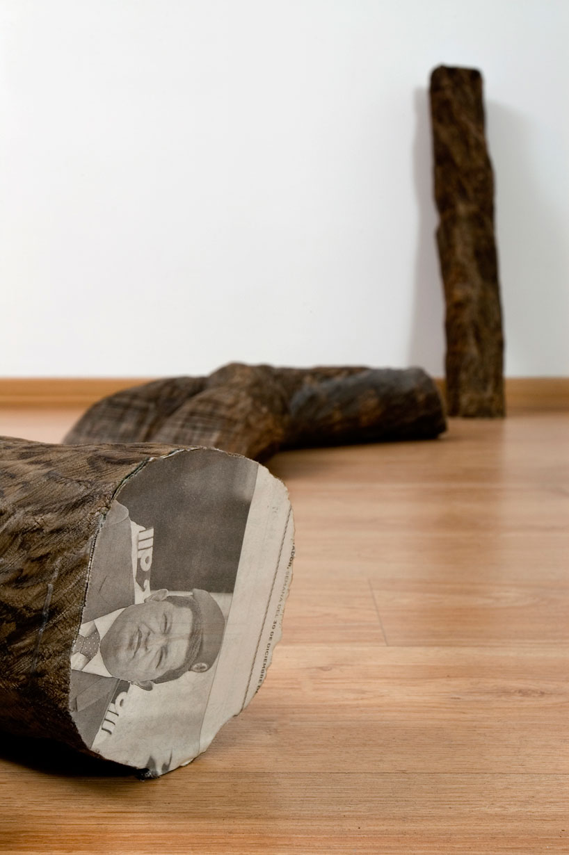 tree trunks made of densely stacked newspapers by miler lagos