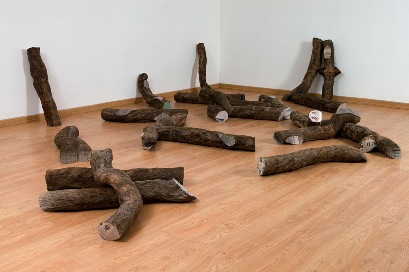 tree trunks made of densely stacked newspapers by miler lagos