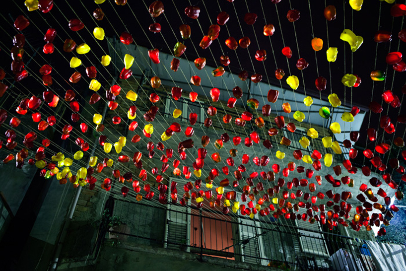 luzinterruptus illuminates the sky with light-filled peppers