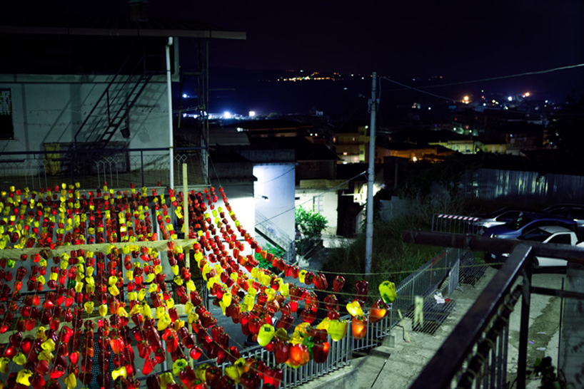 luzinterruptus illuminates the sky with light-filled peppers