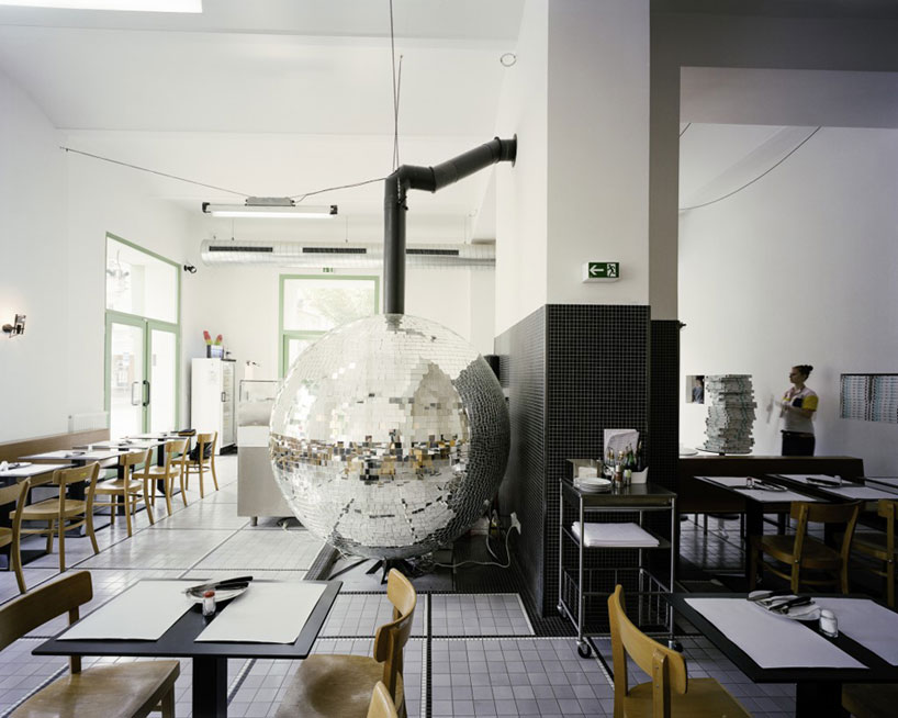 madame mohr centers pizzeria around rotating disco ball oven