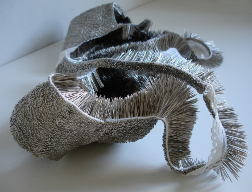 erwina ziomkowska pinches wardrobe garments with spiky pins