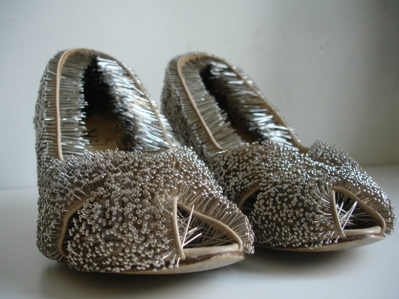 erwina ziomkowska pinches wardrobe garments with spiky pins