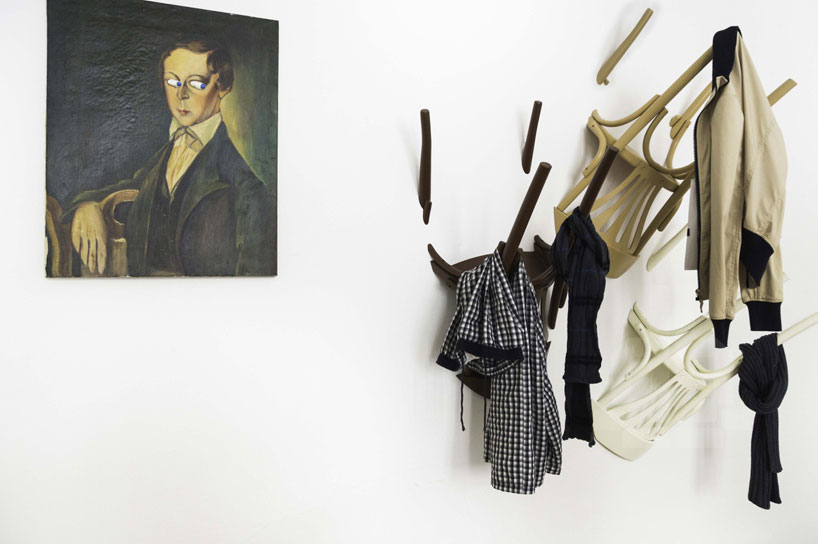 nikos tsoumanis suspends chairs upside down in hanging wairs