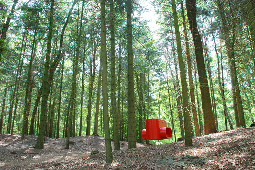 rob sweere suspends the hub in a forest
