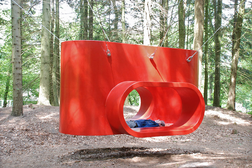 rob sweere suspends the hub in a forest