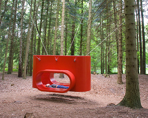 rob sweere suspends the hub in a forest