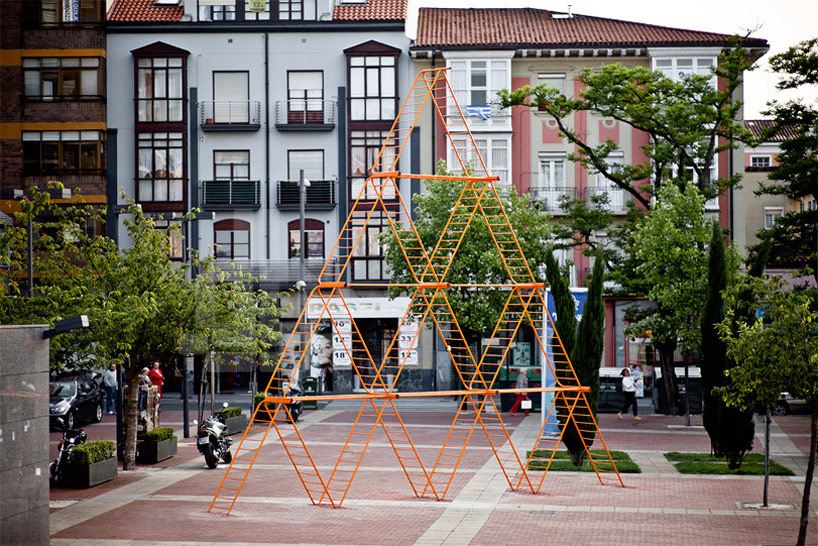 SpY urban art pyramid is constructed from safety barriers