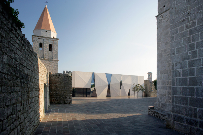 idis turato overlaps old and new with krk sports hall + square