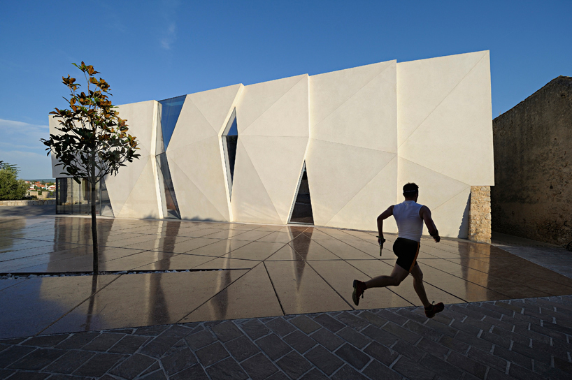 idis turato overlaps old and new with krk sports hall + square