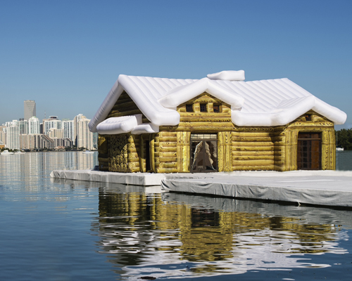 inflatable snow chalet by kolkoz floats in miami's biscayne bay