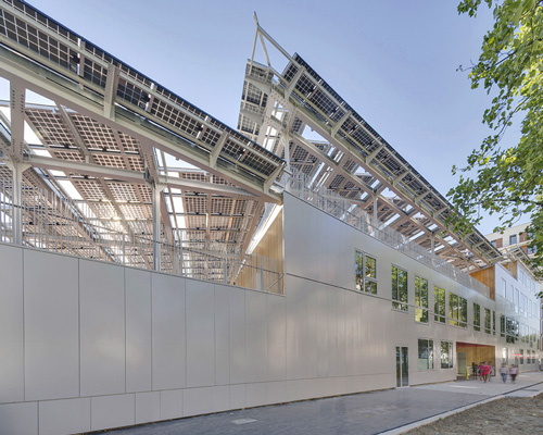 mikou design studio clads zero energy school in solar panels