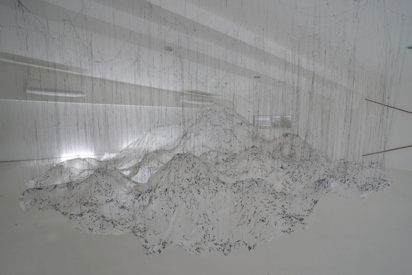 yasuaki onishi floats reverse of volume with dripping hot glue