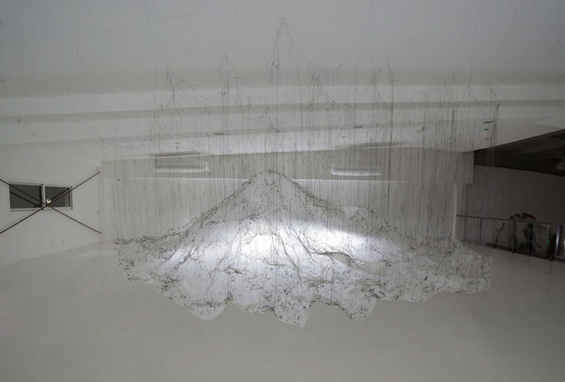 yasuaki onishi floats reverse of volume with dripping hot glue