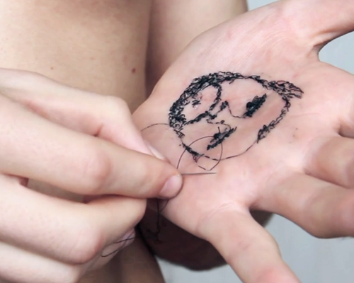 david cata sews portraits of his family into the palm of his hand