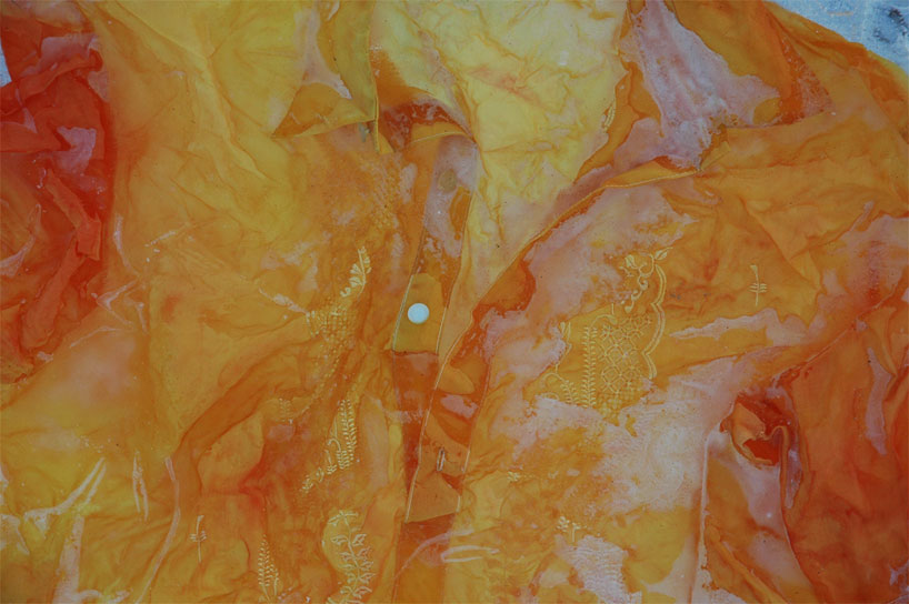 nicole dextras freezes garments in solid blocks of ice