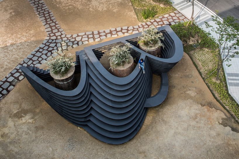 unsangdong architects compose stepped iron landscape